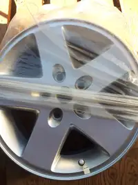 ONE JEEP 17" RIM, NEW TAKE OFF FROM SPARE, WITH SENSOR