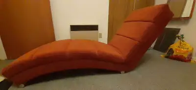 Super comfortable relaxing lounge chair. Colour is a rusty orange,soft material which was sprayed wi...