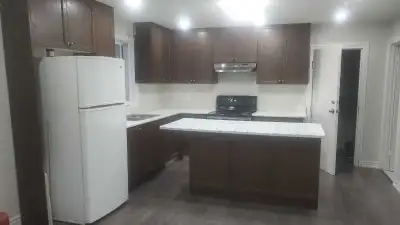 This bright and inviting 1-bedroom legal walkout basement apartment features an open-concept kitchen...