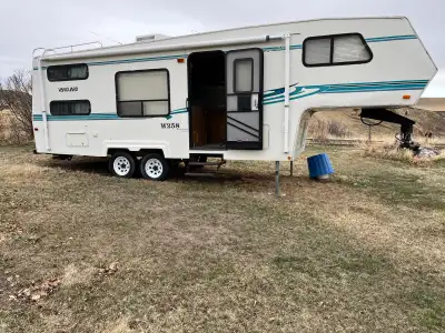 Fifth wheel trailer with Jack and Jill bunks and queen master bed. Sleeps 9. Everything works. Call...