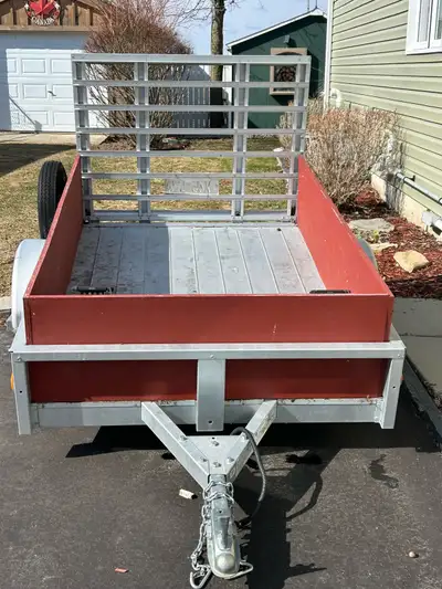 Sterling 4 ft. X 6 ft galvanized utility trailer c/w plywood box sides and spare tire. Like new only...