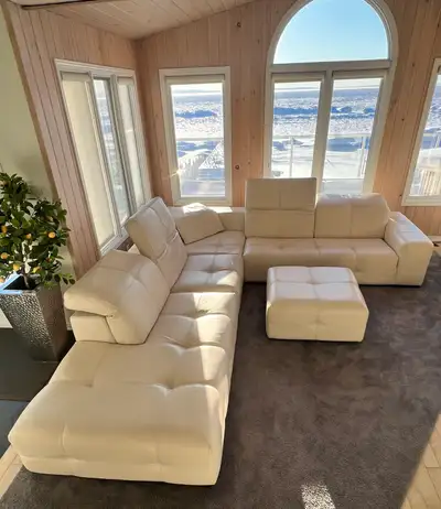 Beautiful off-white leather, original Natuzzi sectional with ottoman It's almost in excellent condit...
