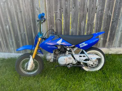 2007 CRF 50 BBR bars and throttle with Scott grips BBR triple Tall seat Aftermarket shifter Street t...