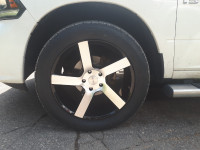 22 INCH TIRES AND RIMS FOR A DODGE RAM 1500