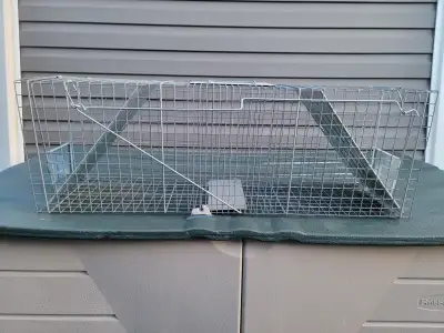Havahart live trap, dual door, large size for raccoons etc, measures 3'L x 10"W x 12"H, like new con...