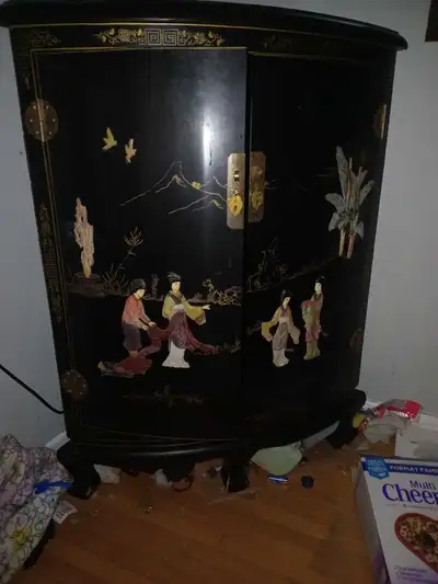 This authentic oriental corner cabinet features exquisite mother of pearl inlay and offers elegant s...