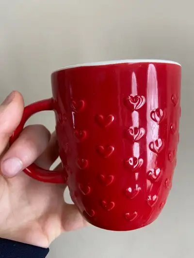 Large red mug. Embossed hearts. Microwave and dishwasher safe. Great for hot beverages. Major inters...