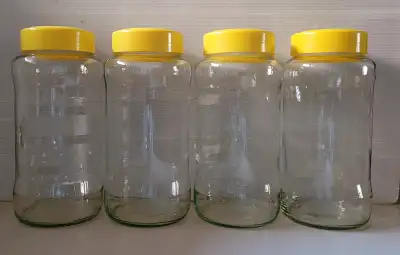 4 Large Clear Glass Storage Jars with Yellow Hard Plastic Lids, View more