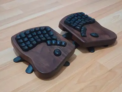Keyboardio Model 100 split ergonomic keyboard in walnut. Like new; barely used. Includes carrying ca...