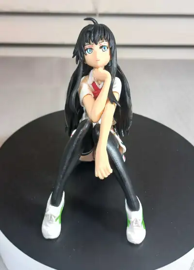 Anime style sitting girl figure, approximately 5" tall. Great condition with no damage. Detailed pai...