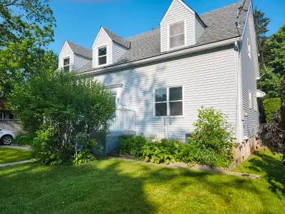 This 6 to 7 bedroom home has a Gorgeous Updated New Kitchen with Island and Built in High End Applia...