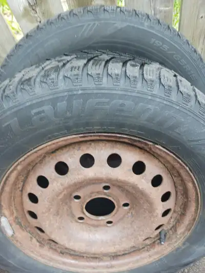 4-15" snow tires on steel rims. Tires are 195/65/R15". Bolt pattern for rims is: 5x114.3m. Center hu...