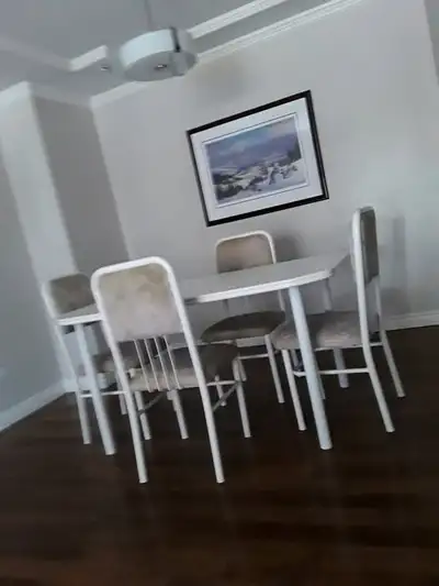 Kitchen table with metal chairs and table legs , the top is in l, View more