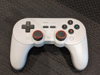 8bitdo Pro2 gamepad with thumb grips