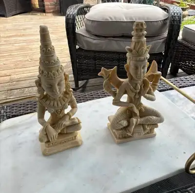 Enhance your home decor with this set of two Asian-style statues. These seated figurines feature int...
