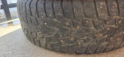 4 sets of tires two of are studded and 4 rim caps