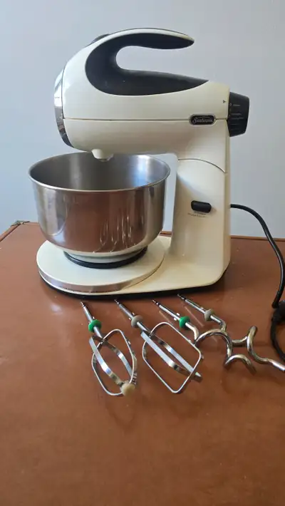 12 speed, Sunbeam stand mixer with two dough hooks and two beaters. Used through one winter season a...