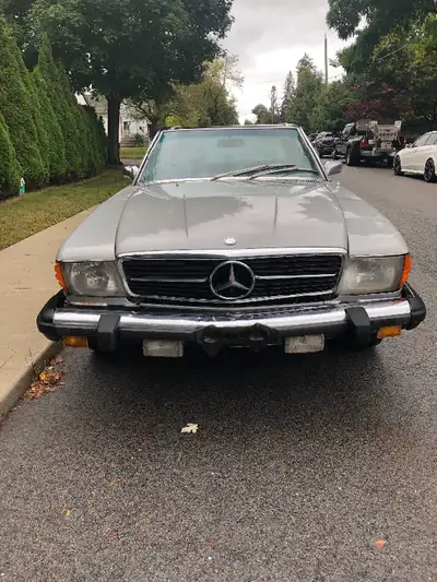 Vintage 2-door classic convertible in running condition. Grey exterior with black hardtop convertibl...