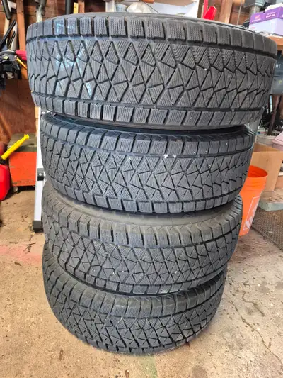 4 Bridgestone Blizzak DM-V2 tires on steel rims. 235/75R15 fits 2010 Ford Ranger and others. 5x4.5 b...