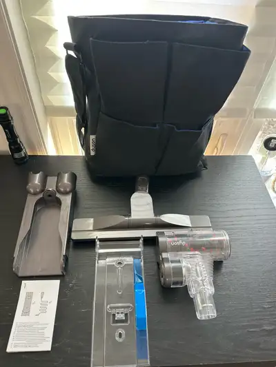 Various Dyson vacuum cleaner attachments. Includes different brush heads and extension wands. New or...