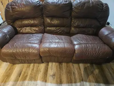 Couch and Lazy boy recliner set Couch reclines as well. Good condition other then the tear starting...