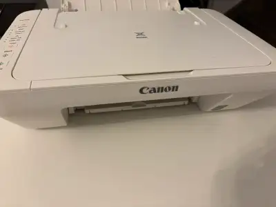 Selling a used Canon PIXMA MG3020 all-in-one printer in white. This printer offers wireless capabili...
