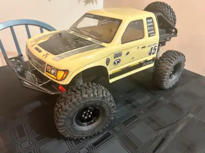Axial honcho new , with upgraded wheels and tires ( so there is two sets the stock ones and the upgr...