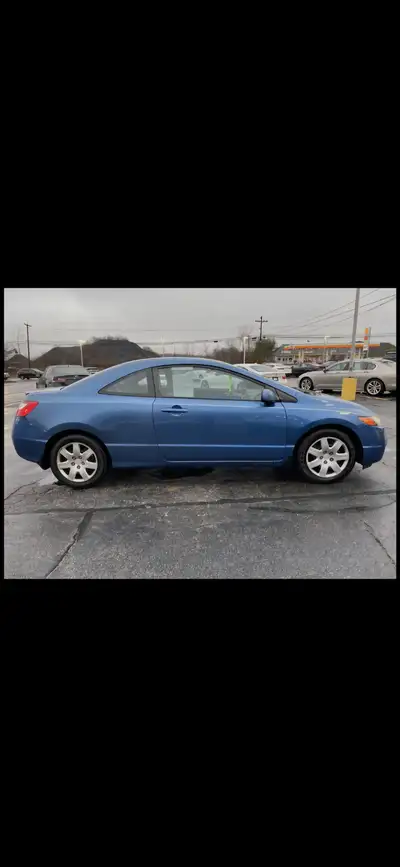 This 2006 Honda Civic DX-G Coupe is known for its reliability, excellent fuel economy, and low maint...