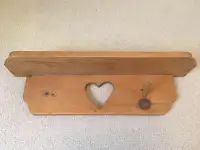 Wall shelf with cutout heart and hanger