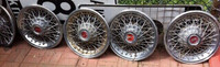 Vintage metal hubcaps with spokes