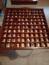 Thimble collection 136 pieces in two display cases