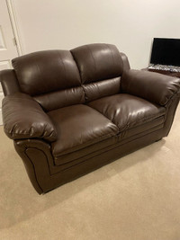 Brown faux leather love seat. Excellent condition! + 42” TV!