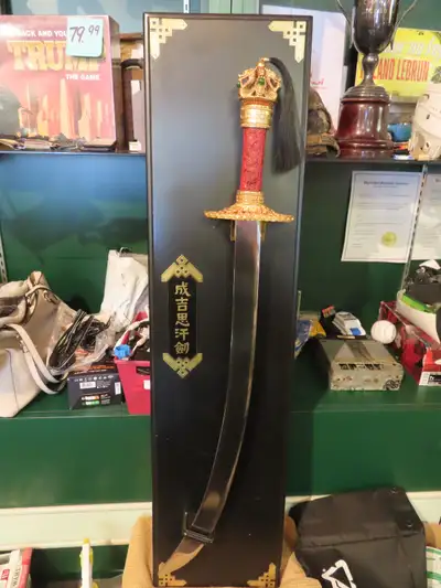 Franklin Mint Replica Genghis Khan's Sword. It is 24K plate and the Pommel has a hidden Dagger. Avai...