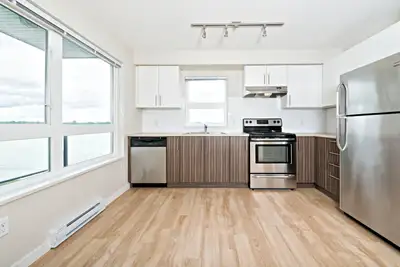 Enjoy spectacular views of the Fraser River and majestic mountains right from your living room. Expe...