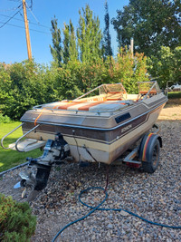 1983 boat and trailer.