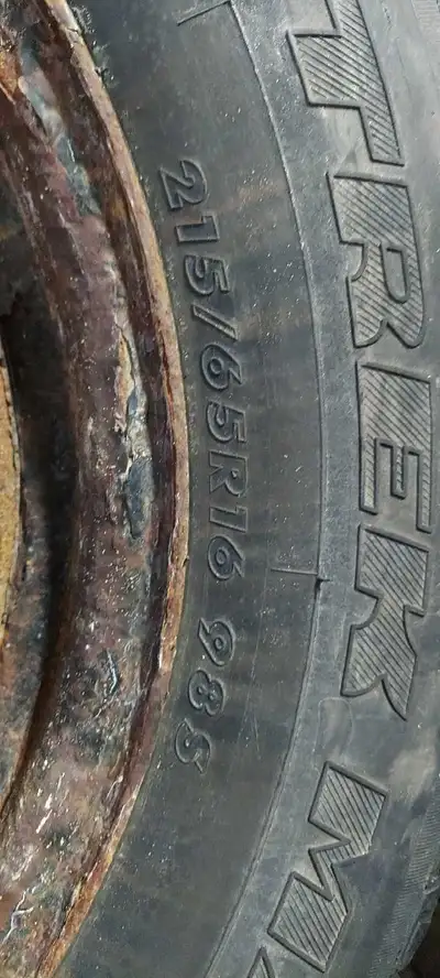 215/65 R16. 4 tires and rims. 2 tire are 1 season old 2 need to be replaced. 5x115 bolt pattern rims...