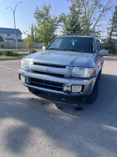 Sale: 2003 Infiniti QX4 - Luxury SUV in Excellent Condition! Key Features: Engine: 3.5L V6 for power...