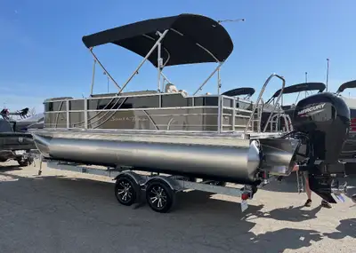 2023 South Bay S222 FCR 3.0 tri‑toon, paired with a 2023 Mercury 150XL FourStroke, a 2023 Karavan ta...