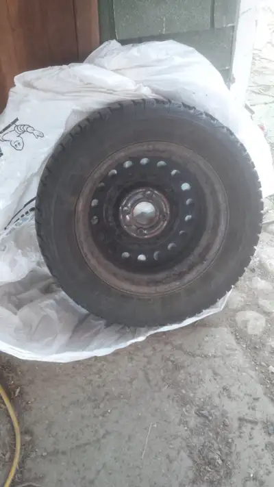4 winter tires, on rims, used on a Nissan Sentra. Still a good amount of tread left. Rims are a bit...