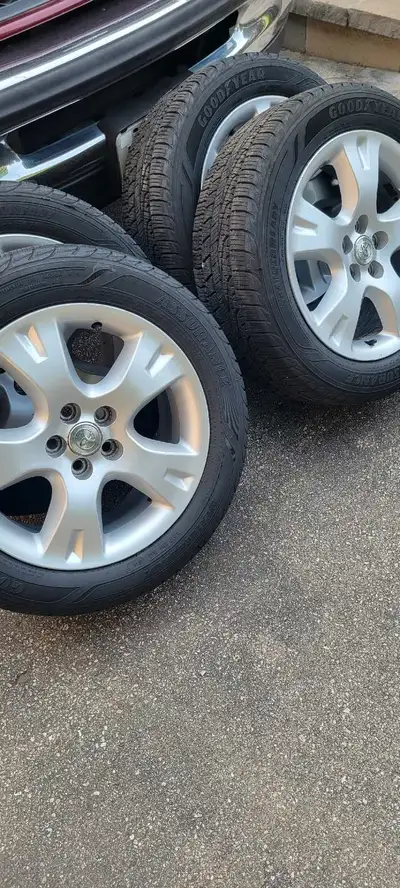 4 Goodyear Assurance All Weather tires on original Toyota alloy rims. 205/55R16. Fit Corolla/ Matrix...