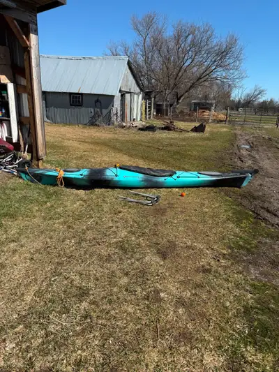 This kayak is very lightly used. Great condition. Rudder has been added. 14 feet long. Paddle and co...