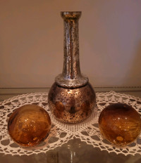Beaten brassy gold decor bottle with amber glass bookend balls