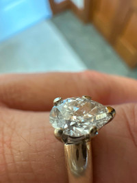 Pear shape diamond ring with 14k white gold wedding band.