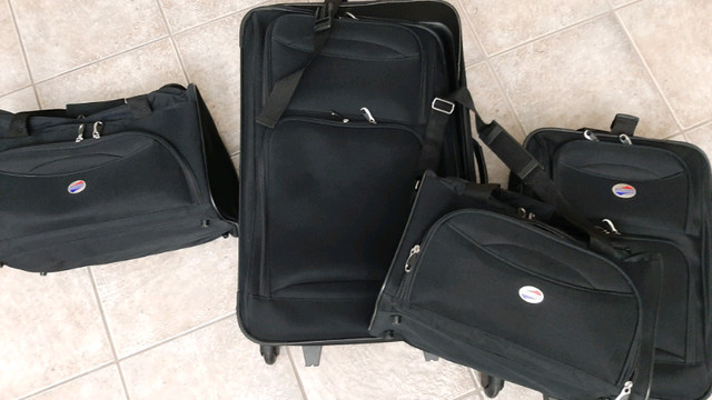 LUGGAGE SET - $80 TOTAL *4-PIECE AMERICAN TOURISTER* in Garage Sales in Windsor Region