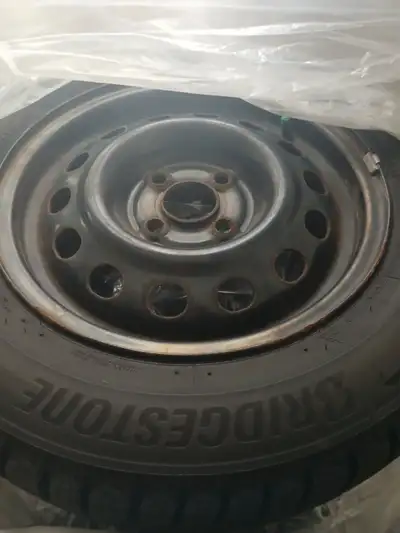 185/65R14 Full set of Bridgestone WS90 Blizzak winter tires and rims. Only on vehicle for one month,...
