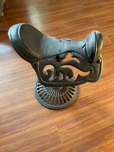 Cast iron saddle. Would fit right into a western theme room. Asking $100 OBO