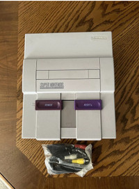 Super Nintendo console and RCA cord (FOR PARTS OR REPAIR)