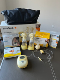 Breast Pump - Medela Freestyle - with extra accessories