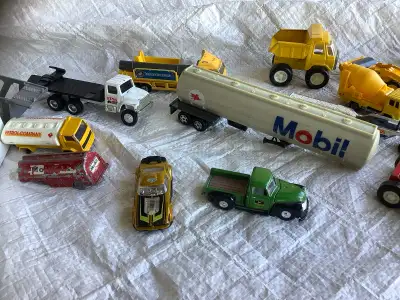 Old dinky brand toys TONKA John Deere Tractors Mobil gas All different brands but the ones in box ar...