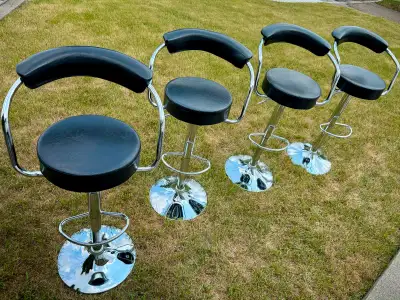 4 x Good condition black height adjustable bar stools for sale. We are renovating and going with a d...